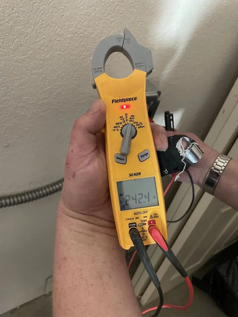 Voltage testing with clamp meter during Aluminum Wiring Replacement in Poteau